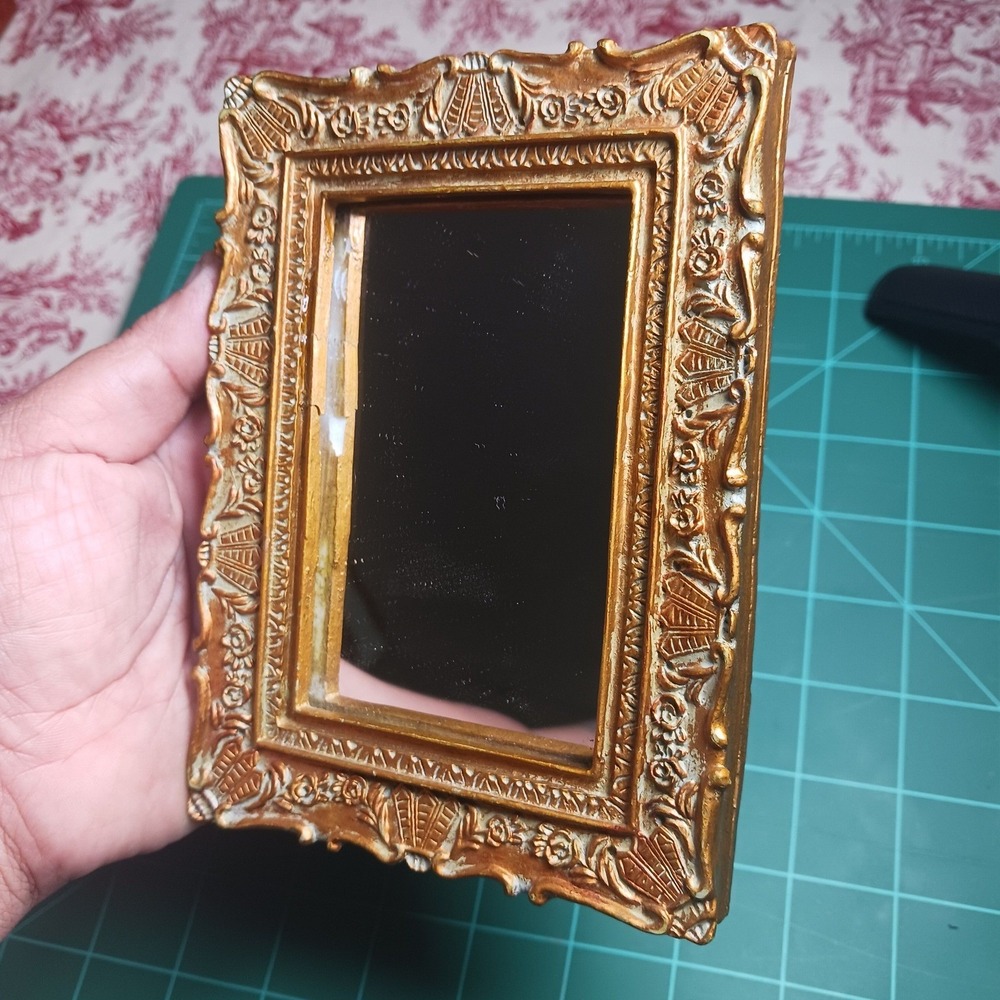 395. Small ornate framed gold mirror *chip
